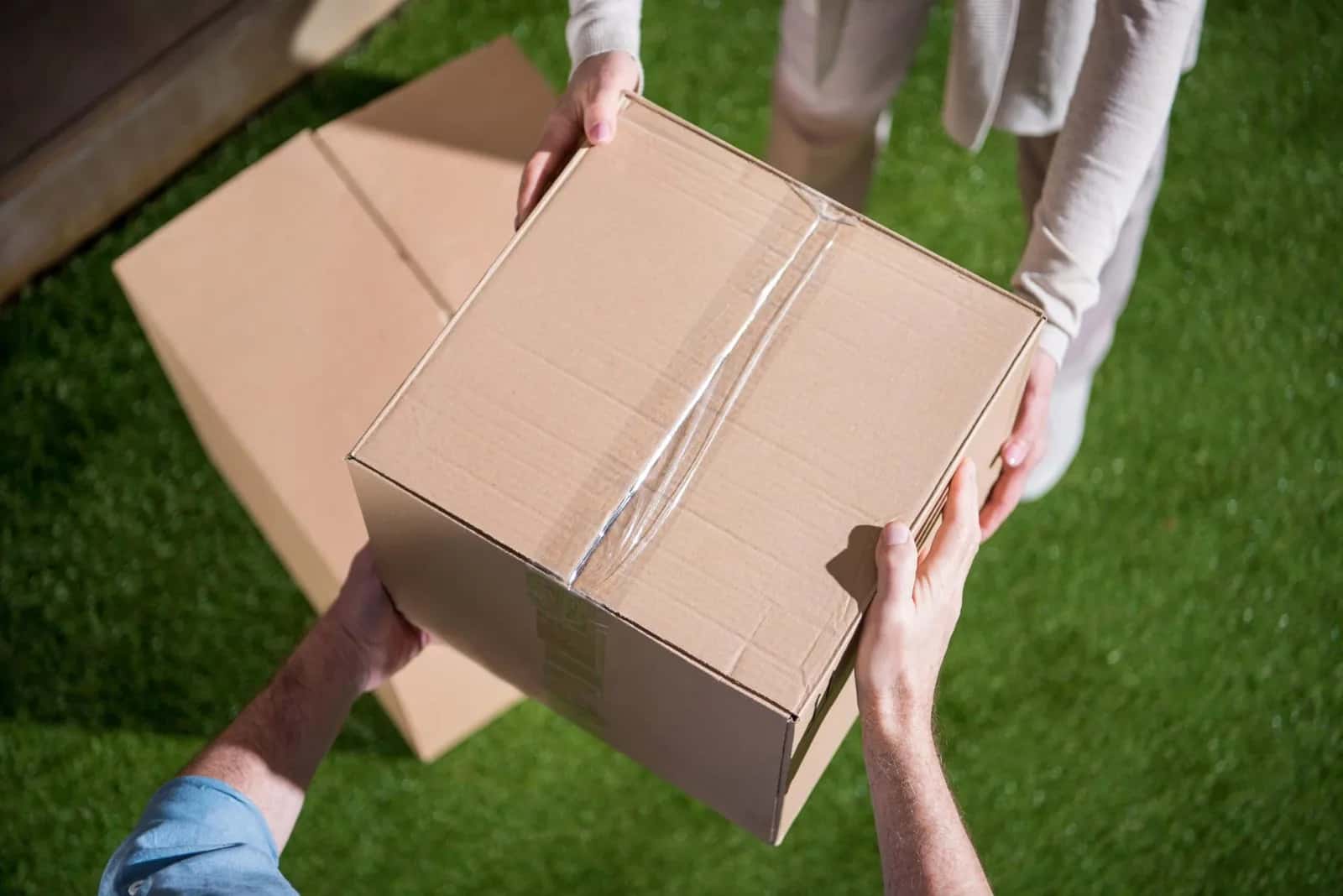 Handing a parcel box to the recipient